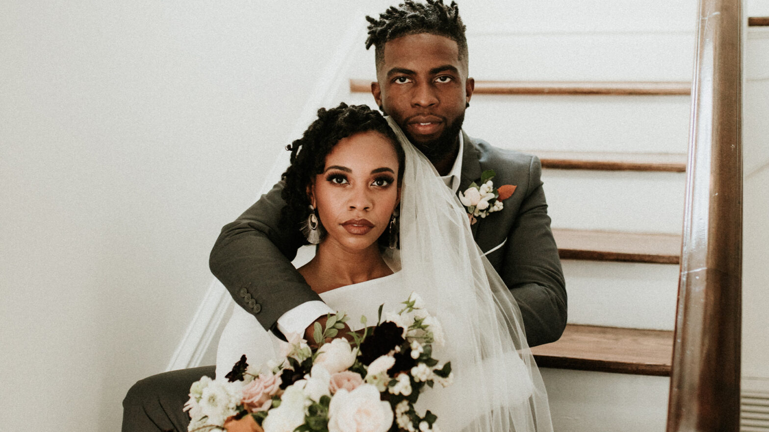 are taurus and capricorn compatible? pictured: married black couple on steps