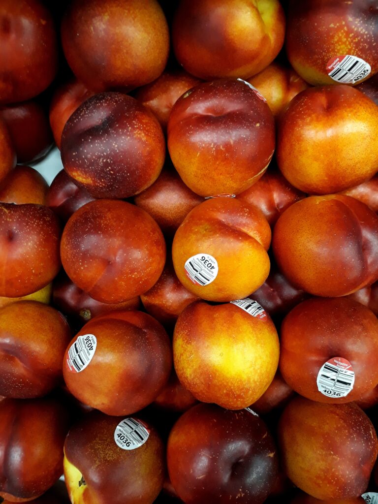 Several grocery store peaches