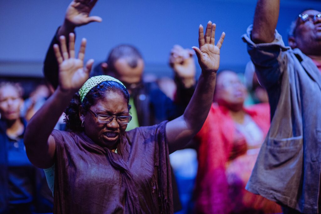 Black congregation worshipping at church