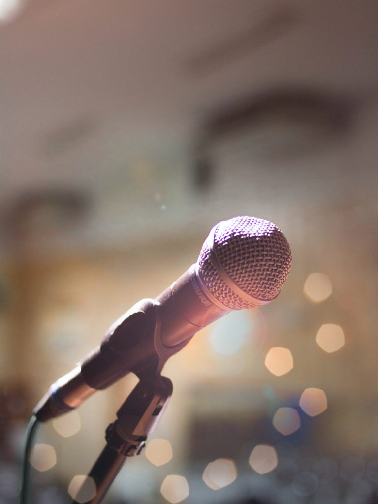 A picture of a microphone on stage 