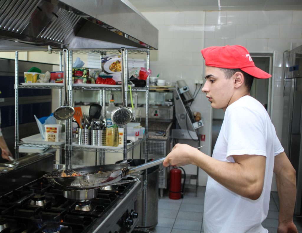 Man cooking in a commercial kitchen