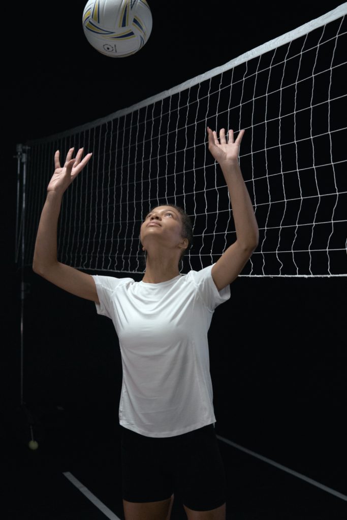Black woman playing volleyball
