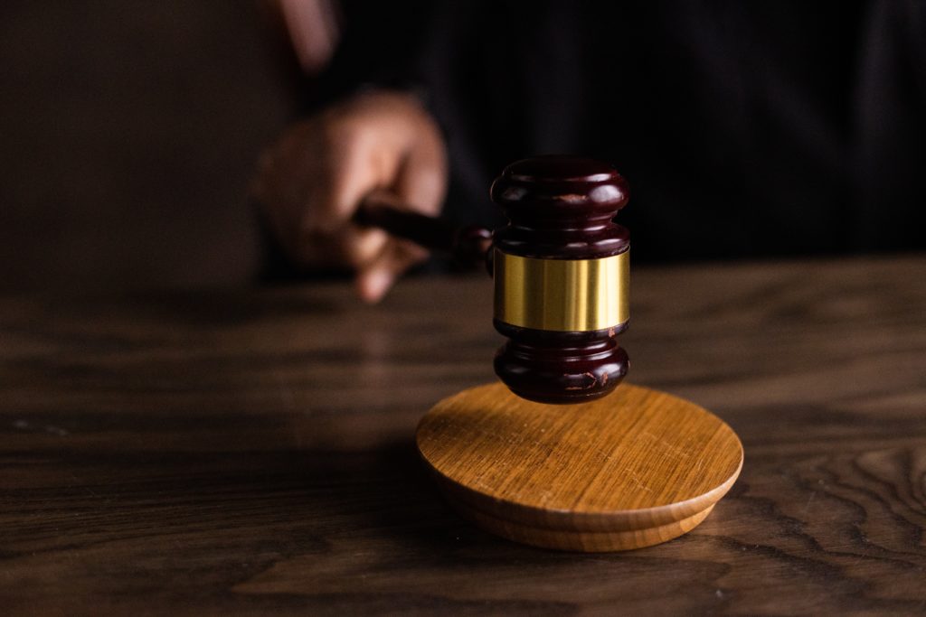 A gavel hitting block in a courtroom