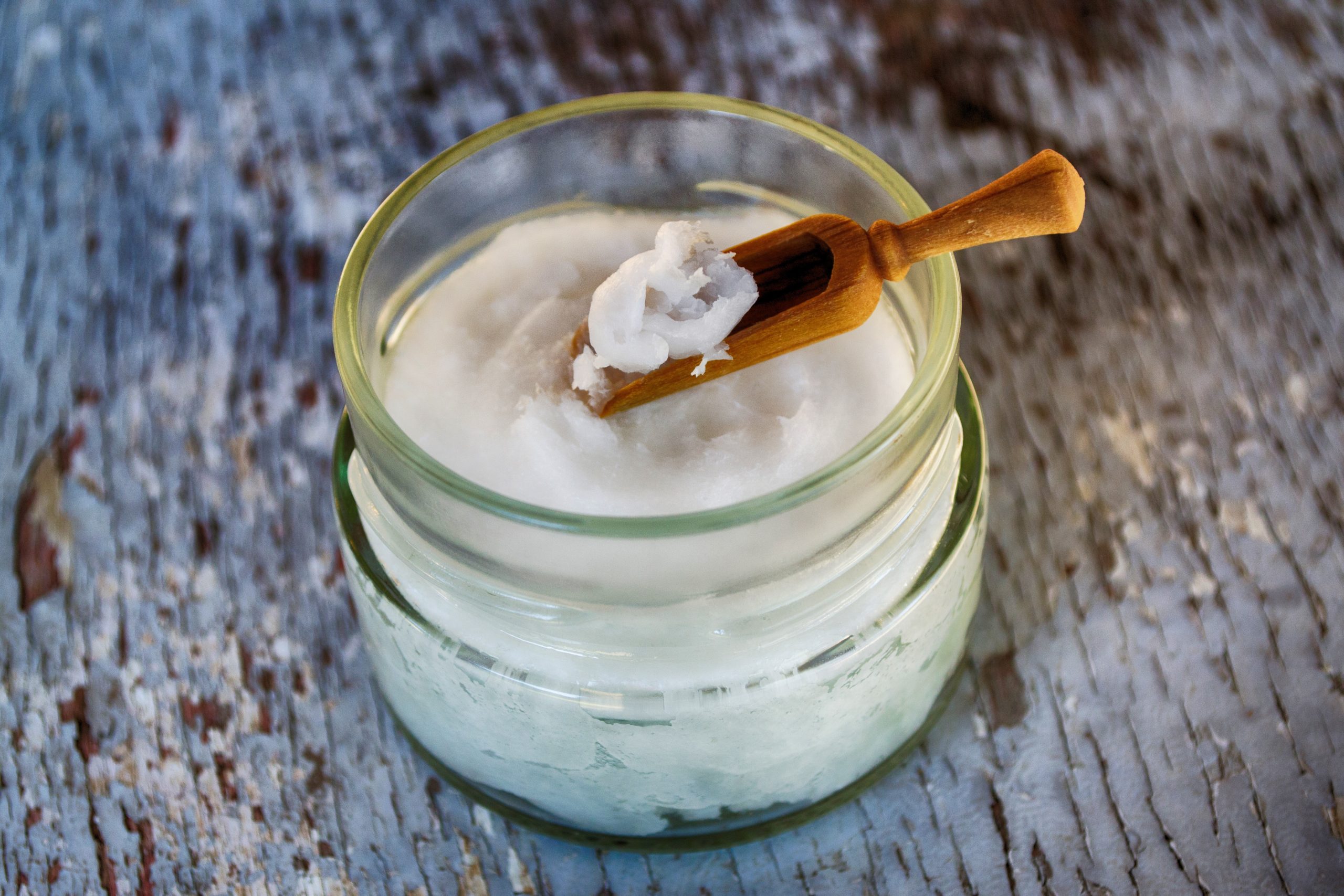 A jar of cream sitting on a countertop