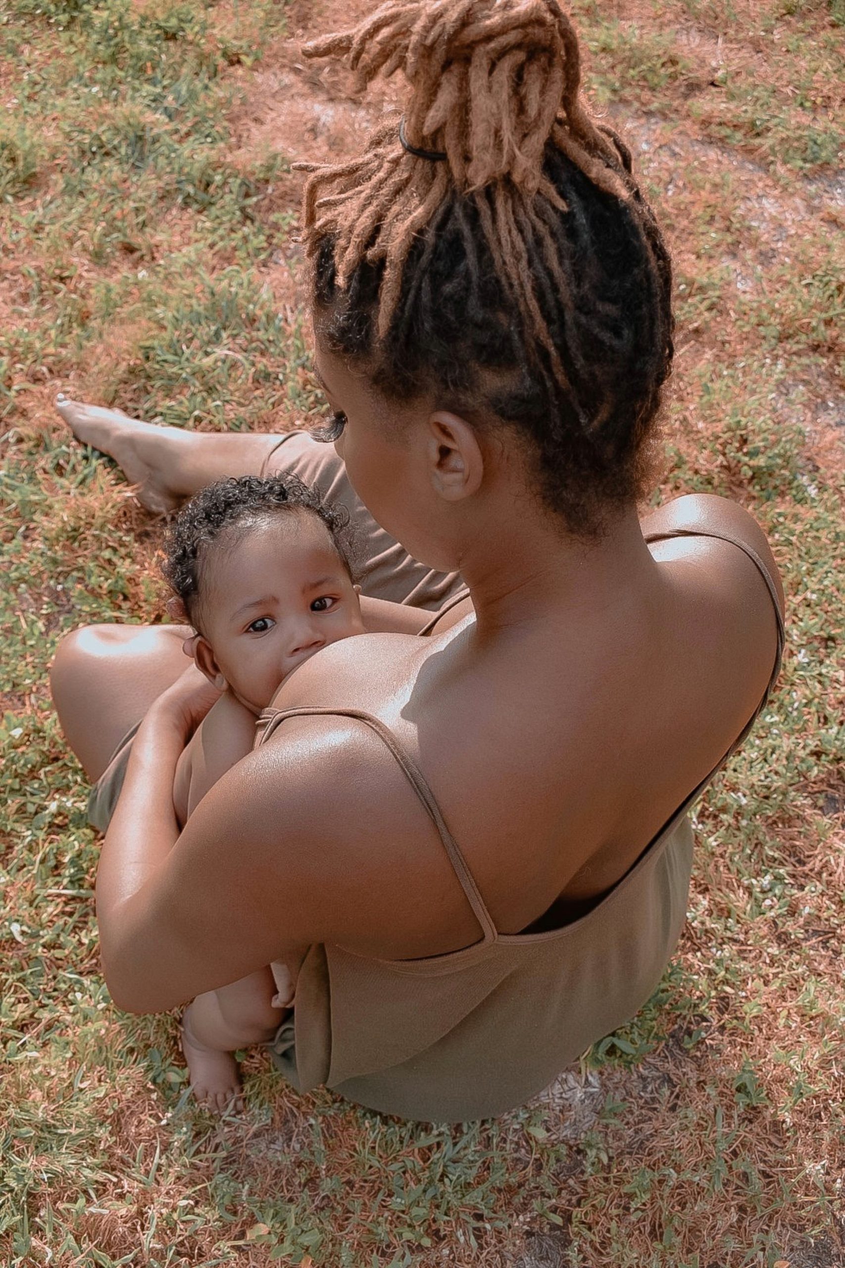 Black mother breastfeeding her baby