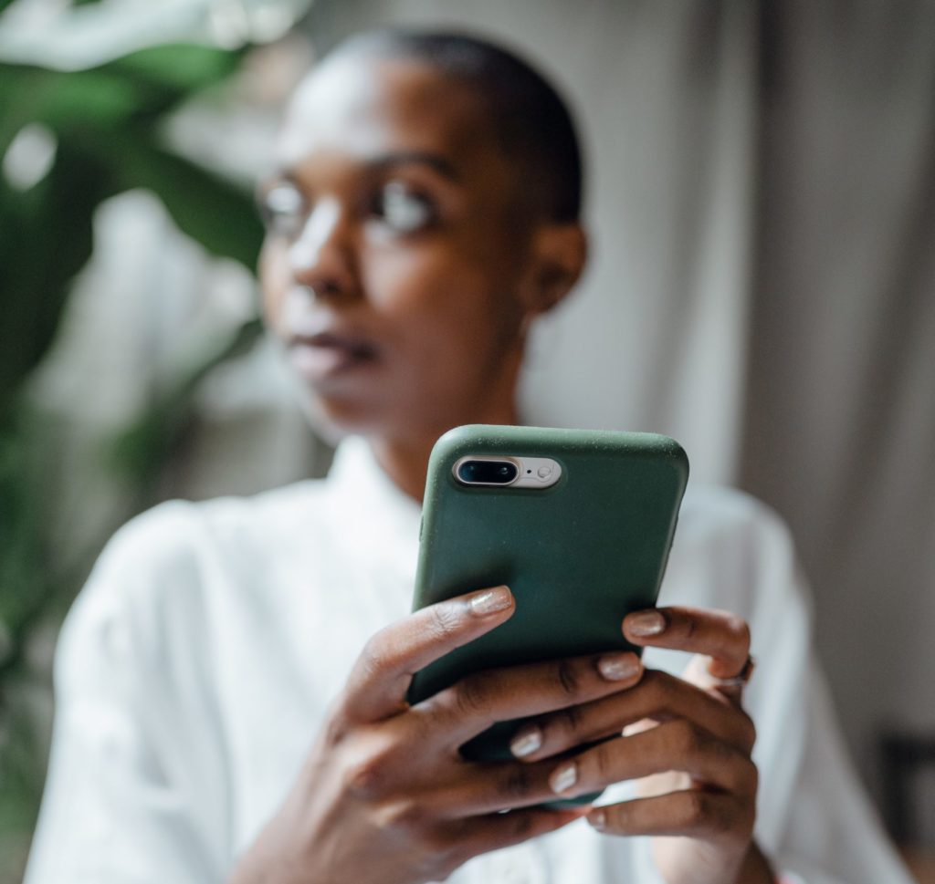 Image of woman holding phone