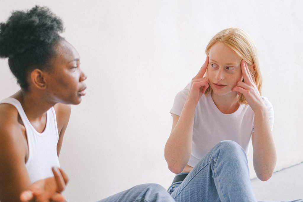 A woman listening to her friend speak