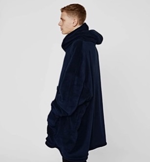 A male model wearing the Hooded Blanket from Sienna