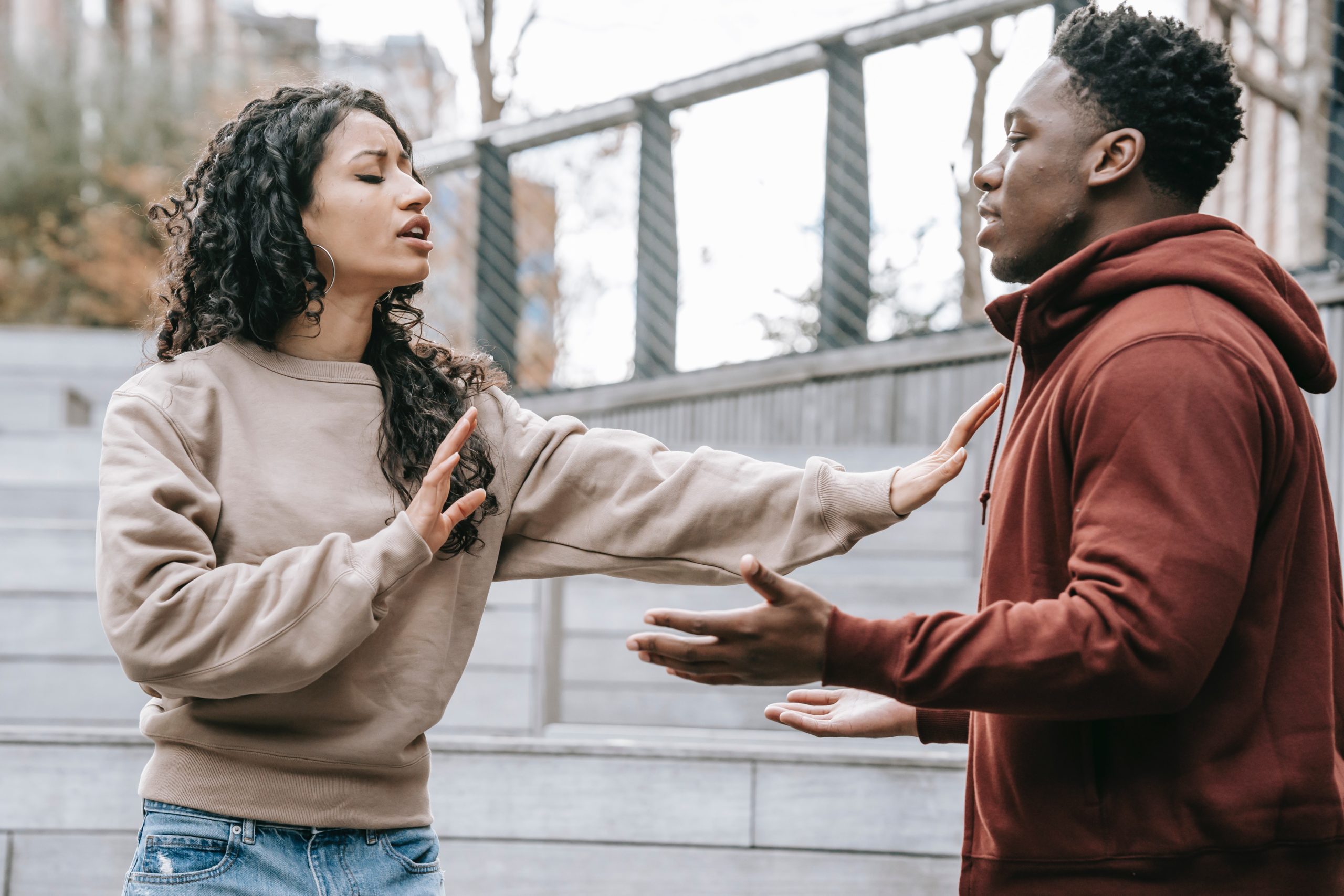 A couple arguing outside