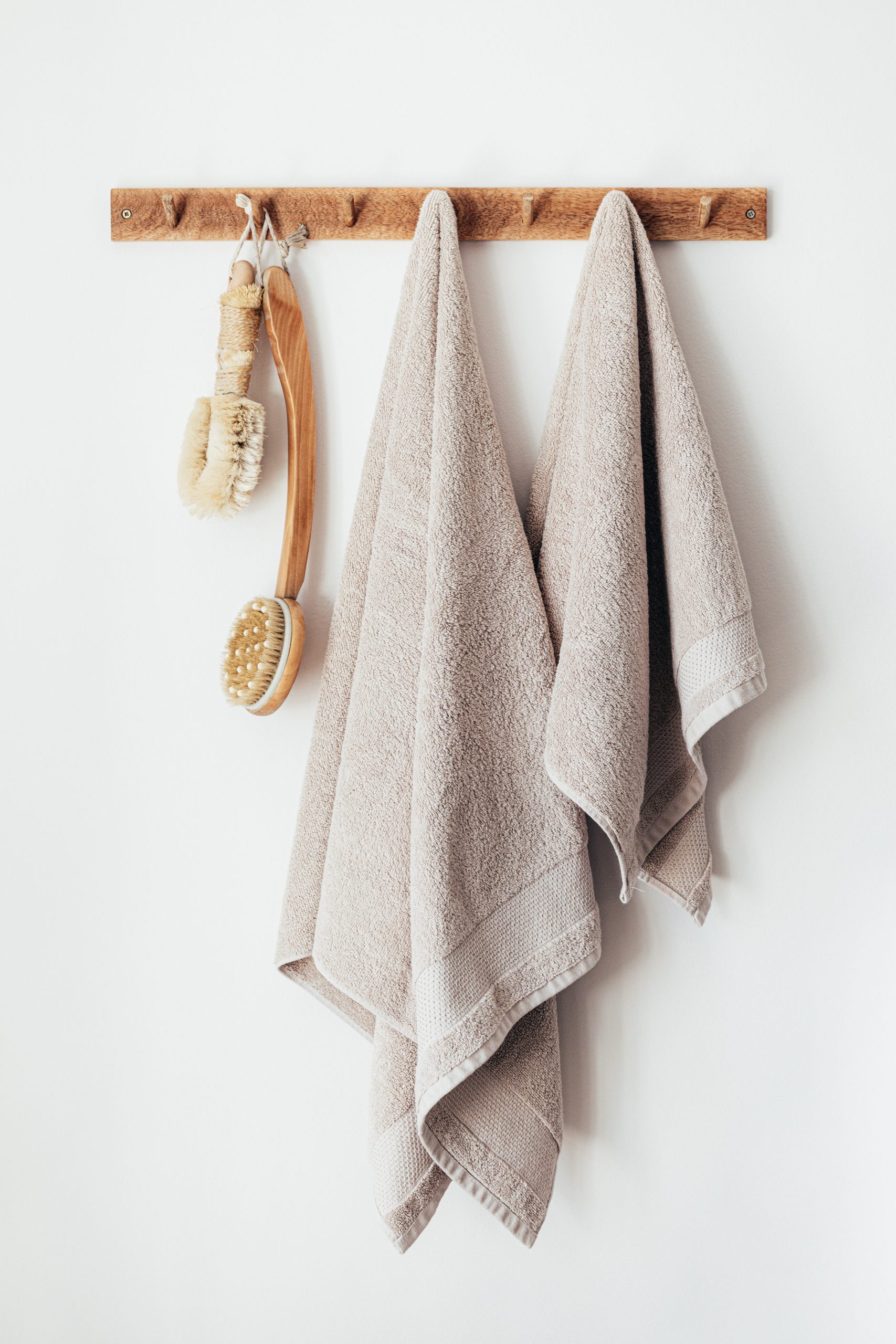 Dry brushing tools hanging up in the bathroom