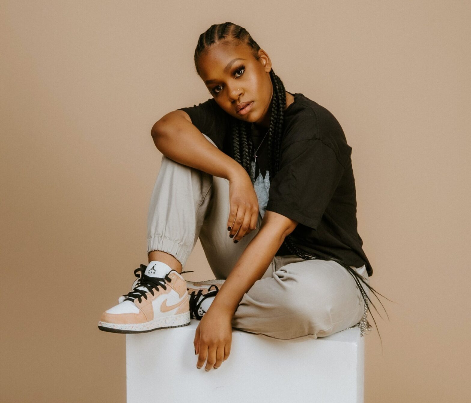 Black woman wearing sneakers