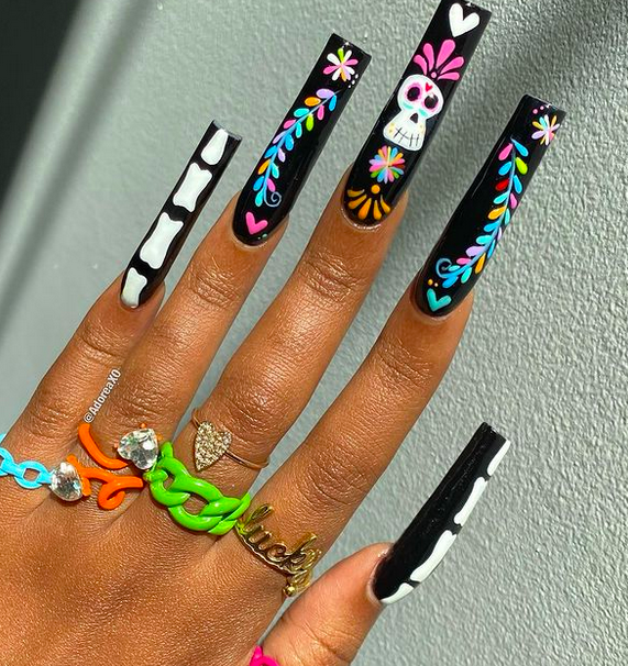 Halloween nails are coming for you this October! Get ready for the season with these ideas. Pictured here is one example of Halloween nail design ideas. Read the full story for more ideas.