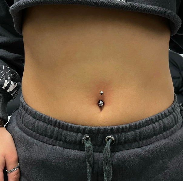 Orbital piercing of the belly button area.
