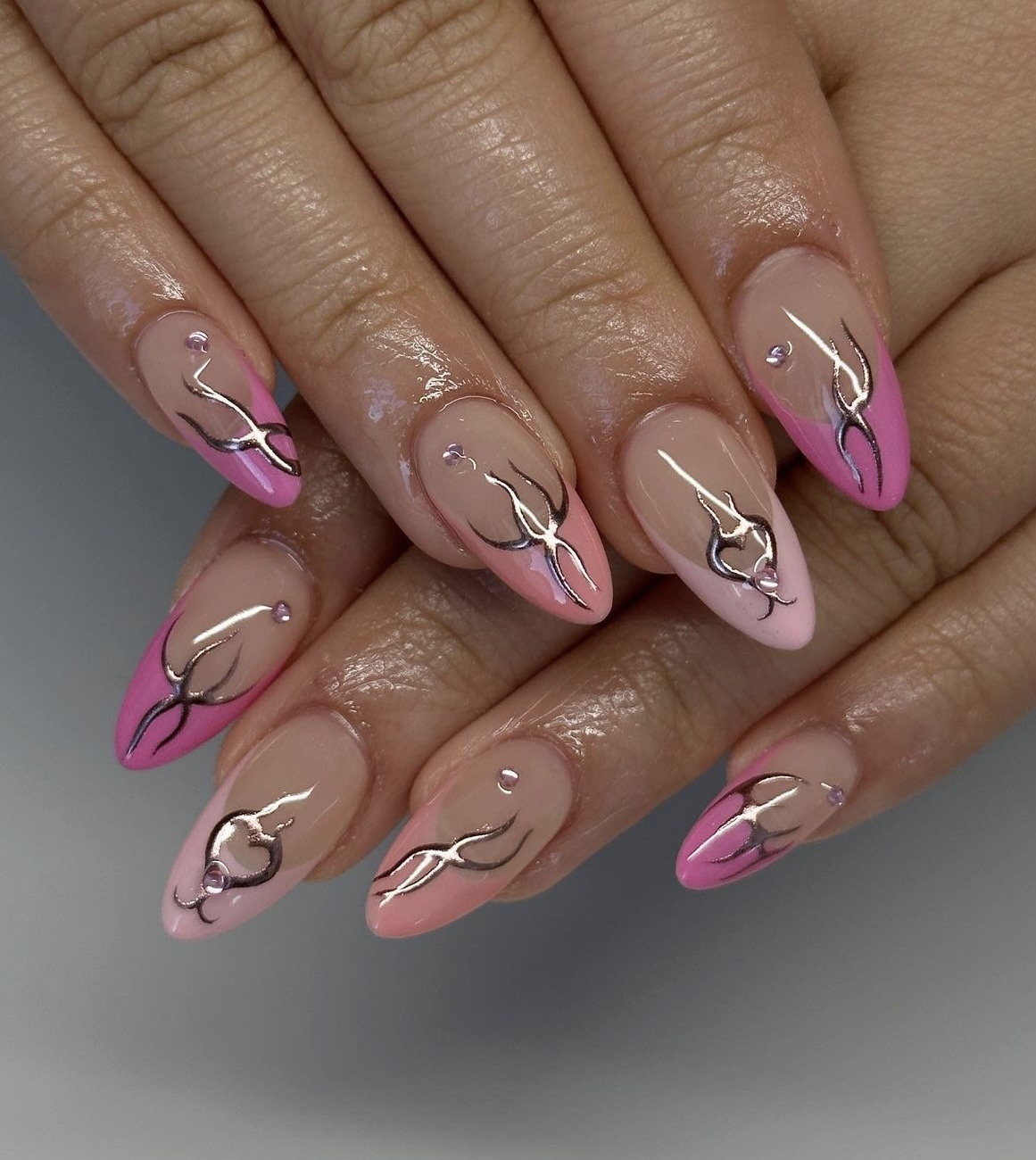 Looking to participate in the Barbie pink nails trend? Here's some inspiration! Picture: pink set of manicured nails.