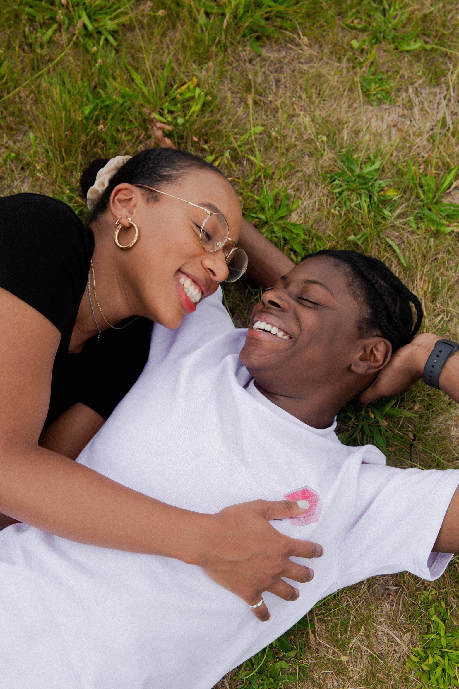 is it infatuation vs love? pictured: smiling couple cuddling