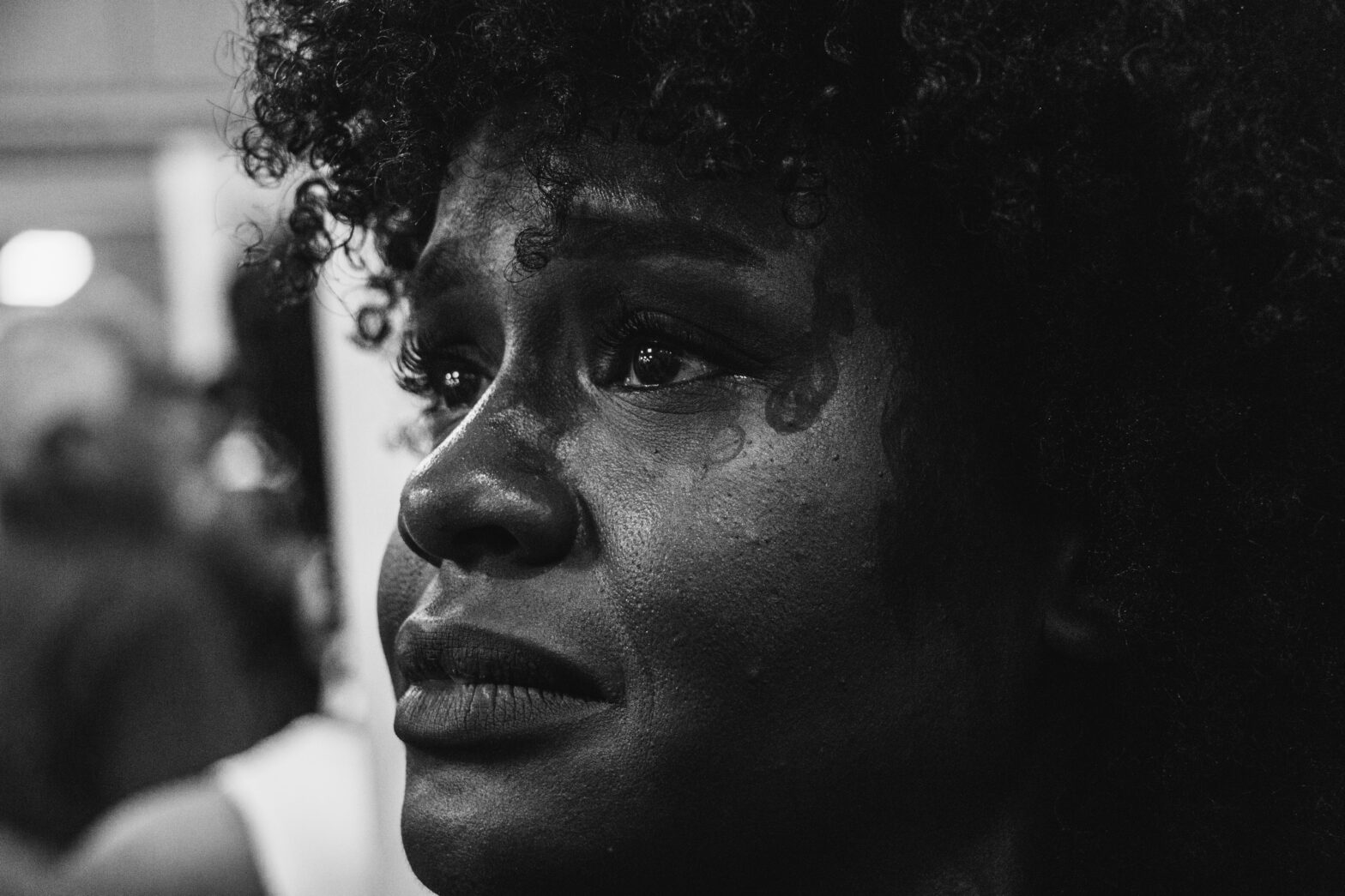 Close up shot of a black woman in tears