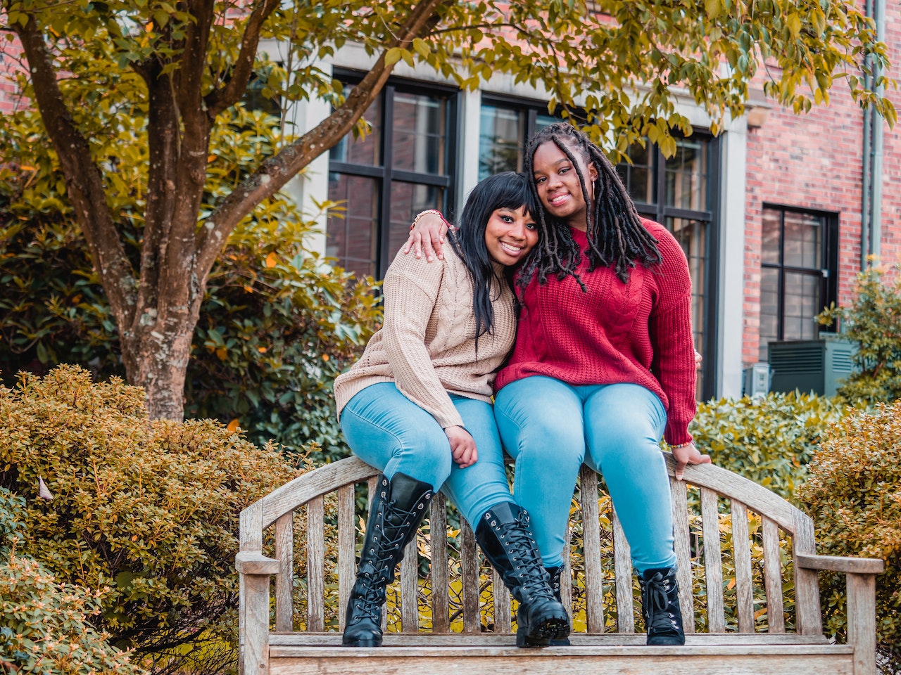 Send one these ride or die quotes to someone that has your back and you have theirs. Pictured: Two black women sitting on a bench ready to take on the world together.