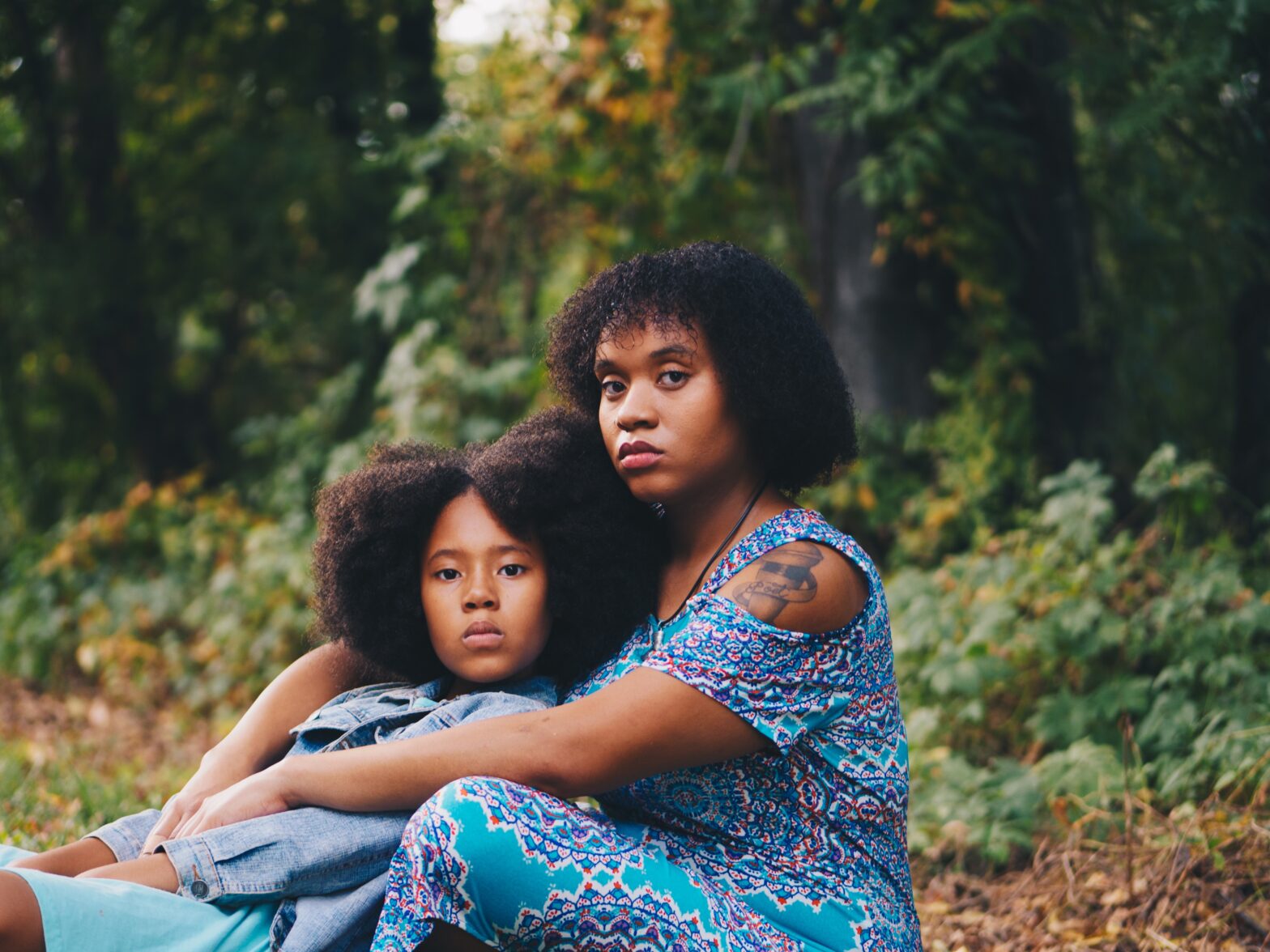 Here are some things narcissistic mothers say, and the best way to respond as healthily as possible. pictured: black mother and daugther hugging.