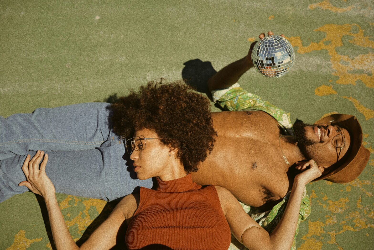 aquarius and aries compatilibity. pictured: black couple laying on ground