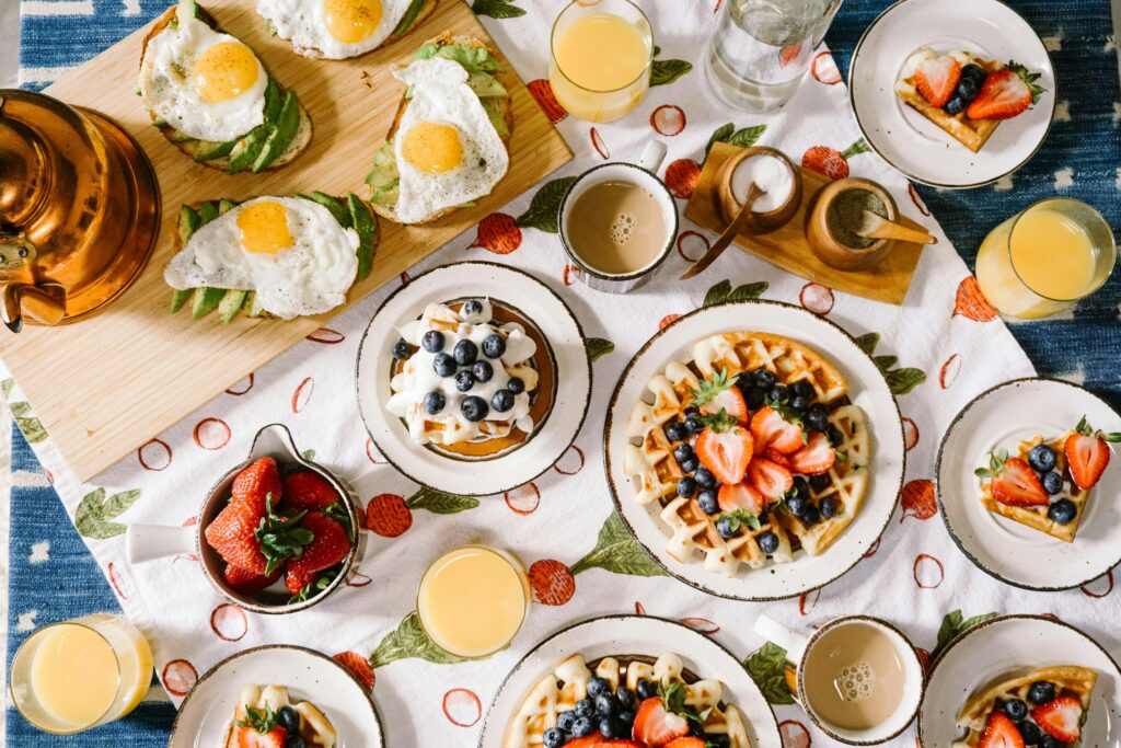 Gather your friends for a delicious Galentine's Day brunch for this idea. Pictured: A table filled with brunch food