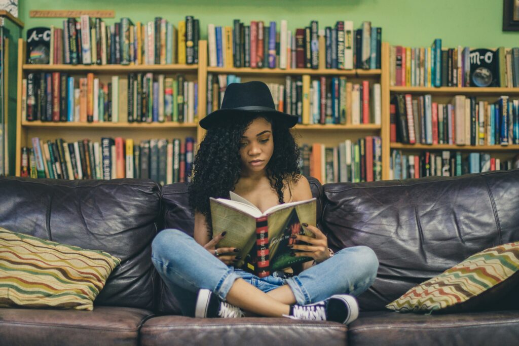 Create a book club Galentine's day night with this idea. Grab everyone's favorite book, or the chosen book for the night and discuss the book over wine and food.Pictured: A woman reading in a bookstore