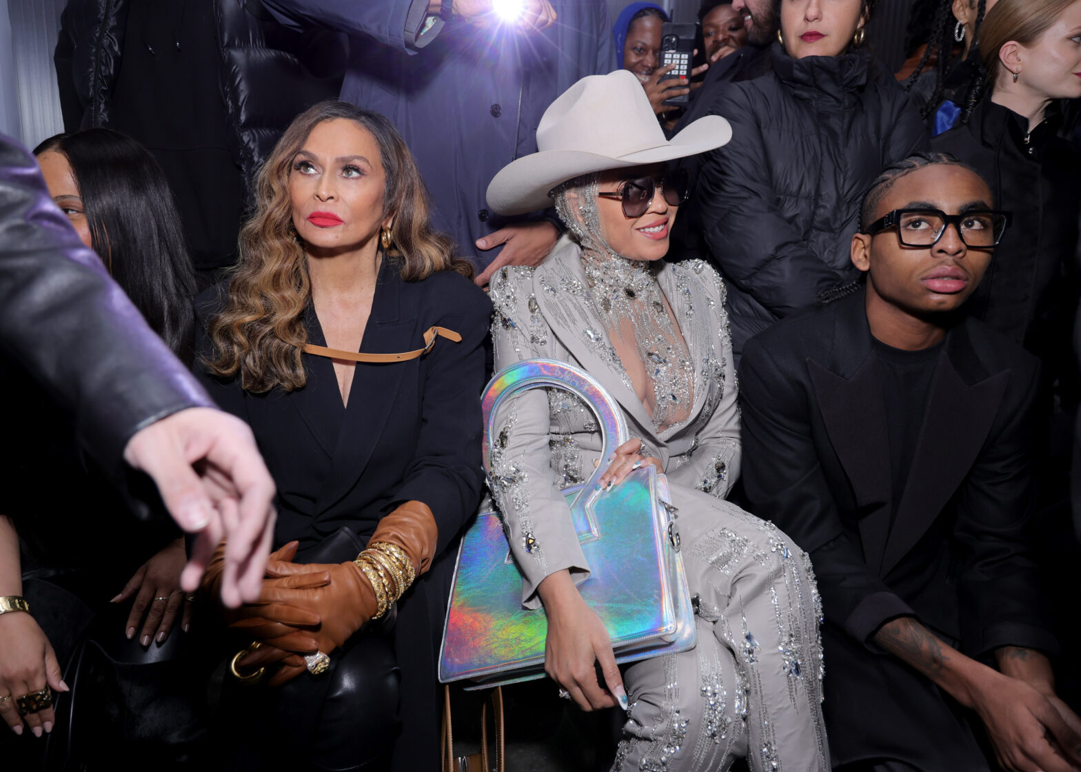 Beyoncé and Tina Knowles sitting front row at a fashion show.