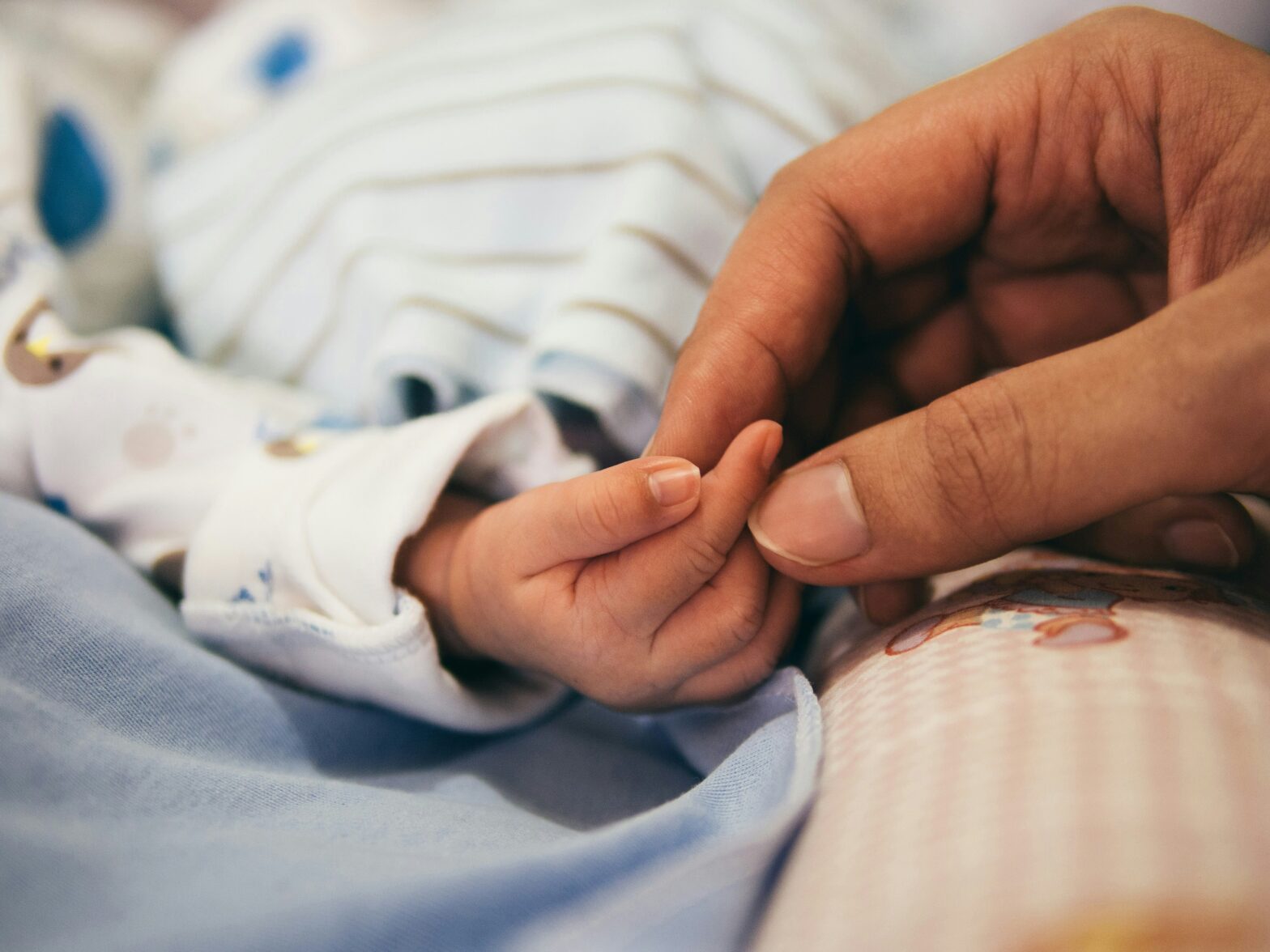 orgasmic birth pictured: newborn baby hand