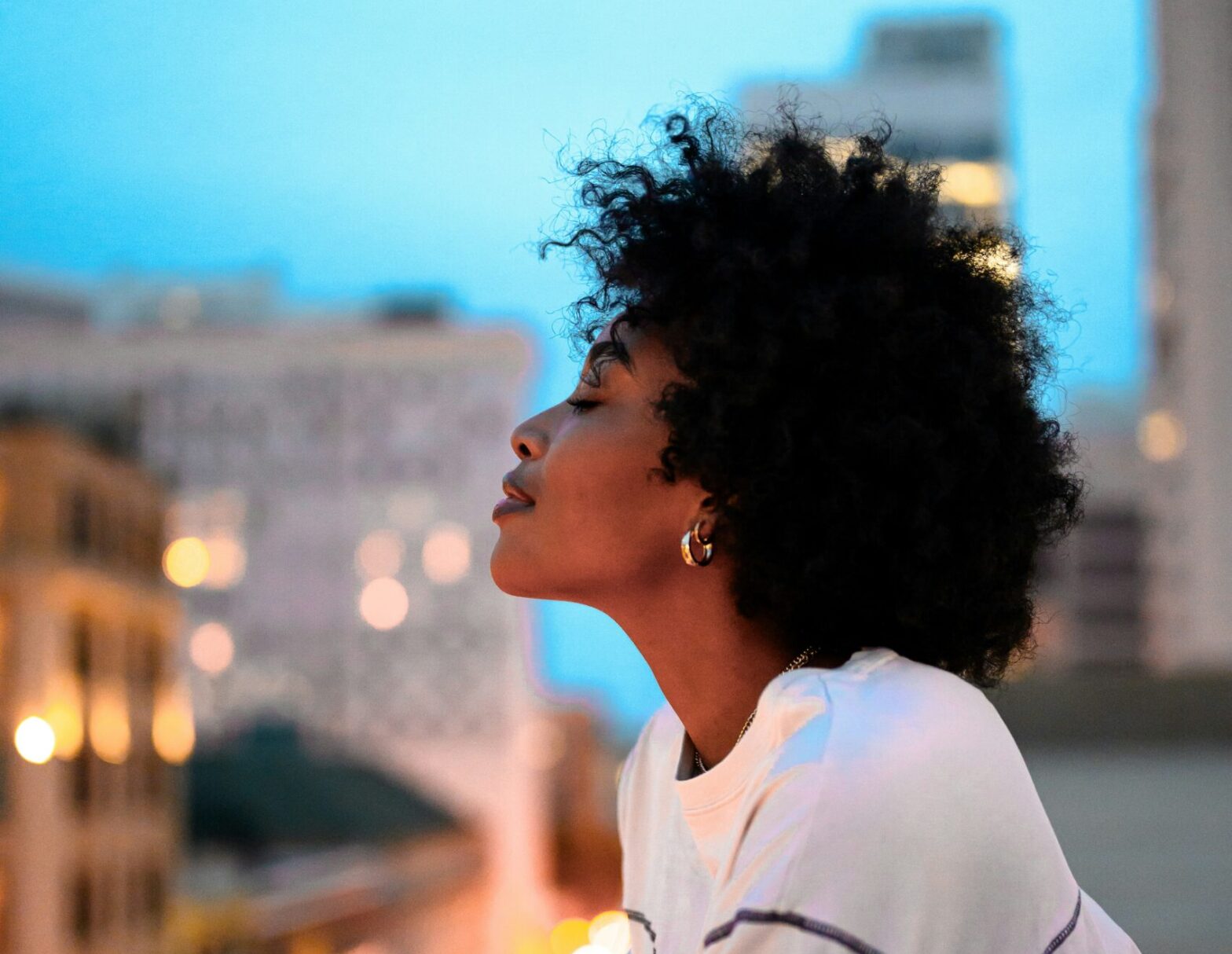 the let them theory explained. pictured: black girl overlooking city