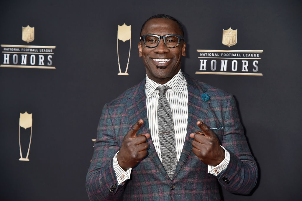 Shannon Sharpe poses on the red carpet at the 8th Annual NFL Honors event.