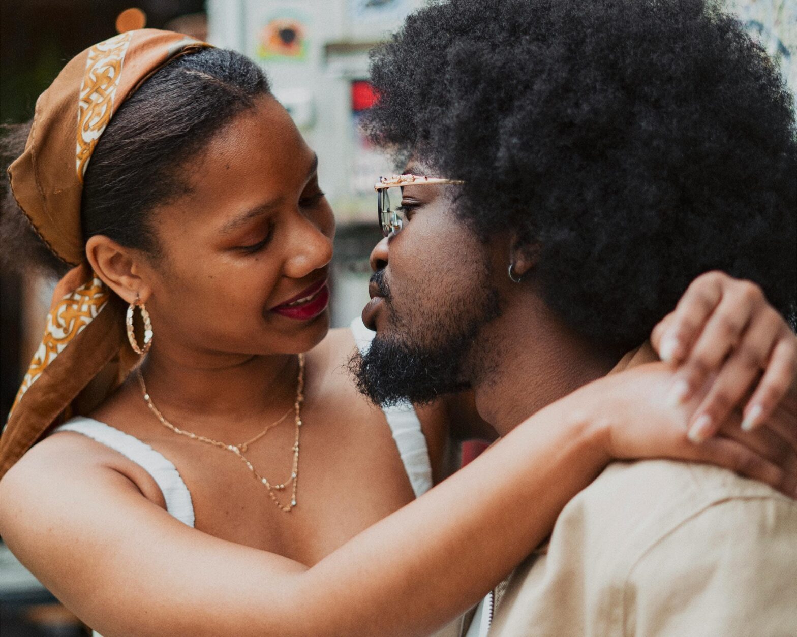 young-Black-couple-standing-face-to-face-and-embracing-lipstick