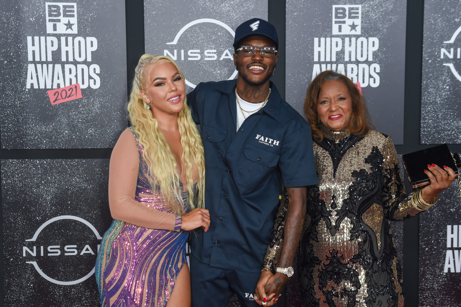 Jacky Oh, DC Young Fly, and his mother arrive to the 2021 BET Hip Hop Awards at Cobb Energy Performing Arts Centre on October 01, 2021 in Atlanta, Georgia.