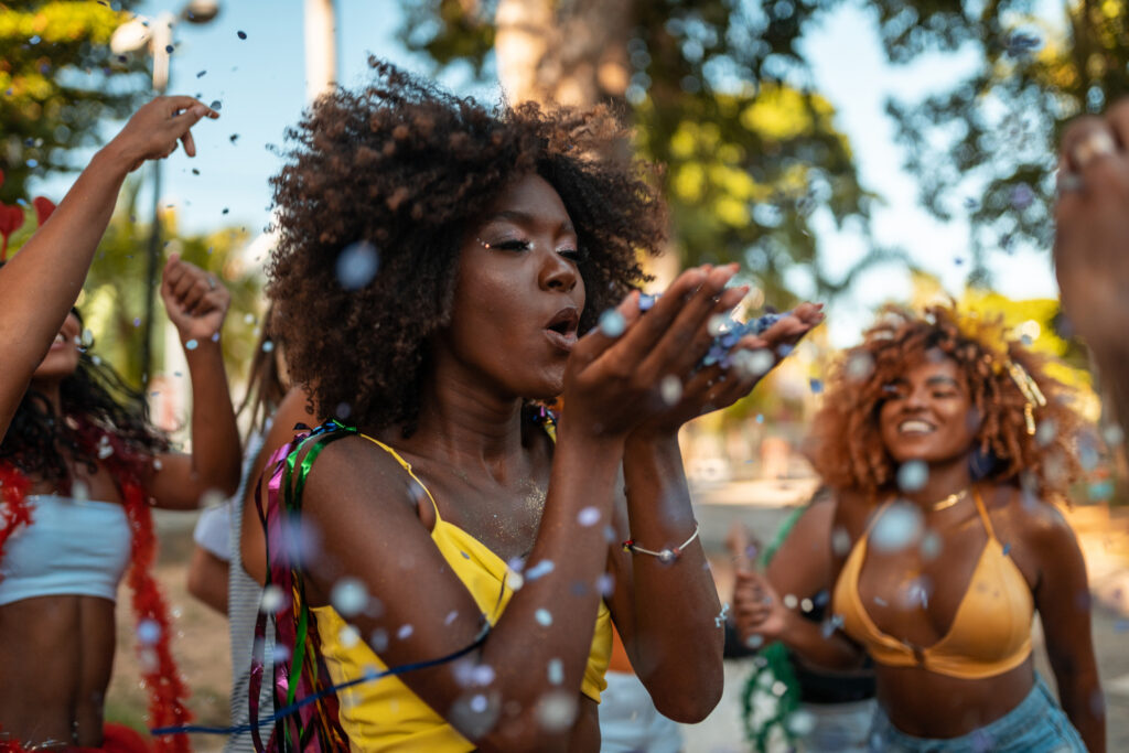 Blowing confetti at the Brazilian Carnaval