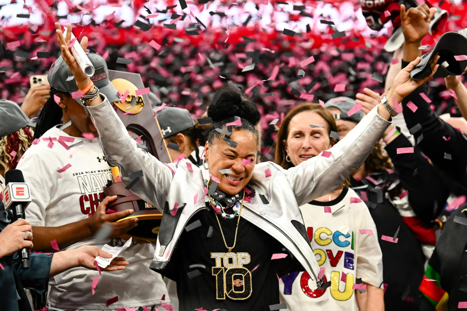 CLEVELAND, OH - APRIL 7: Head coach Dawn Staley of the South Carolina Gamecocks is showered with confetti after defeating the Iowa Hawkeyes 87-75 at the 2024 NCAA Women's Basketball Tournament championship game between Iowa and South Carolina at Rocket Mortgage FieldHouse on April 7, 2024 in Cleveland, Ohio.