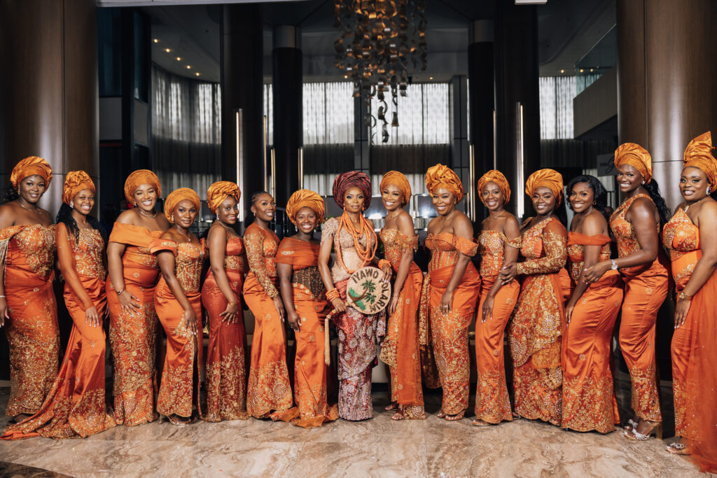 Aso Ebi girls or the unofficial bridal party smiling for the camera