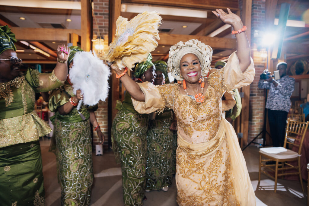 A parent dancing at a Nigerian wedding