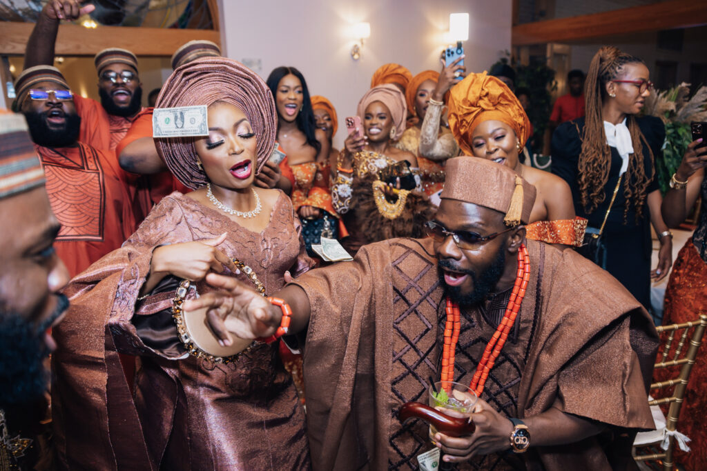 Bridal party dancing into the reception at a Nigerian wedding