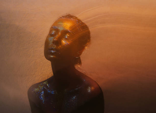 Black Woman Covered in glitter and shine.