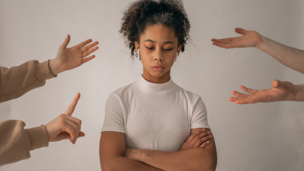 Young black woman being shamed. Overcoming barriers in young black womens health