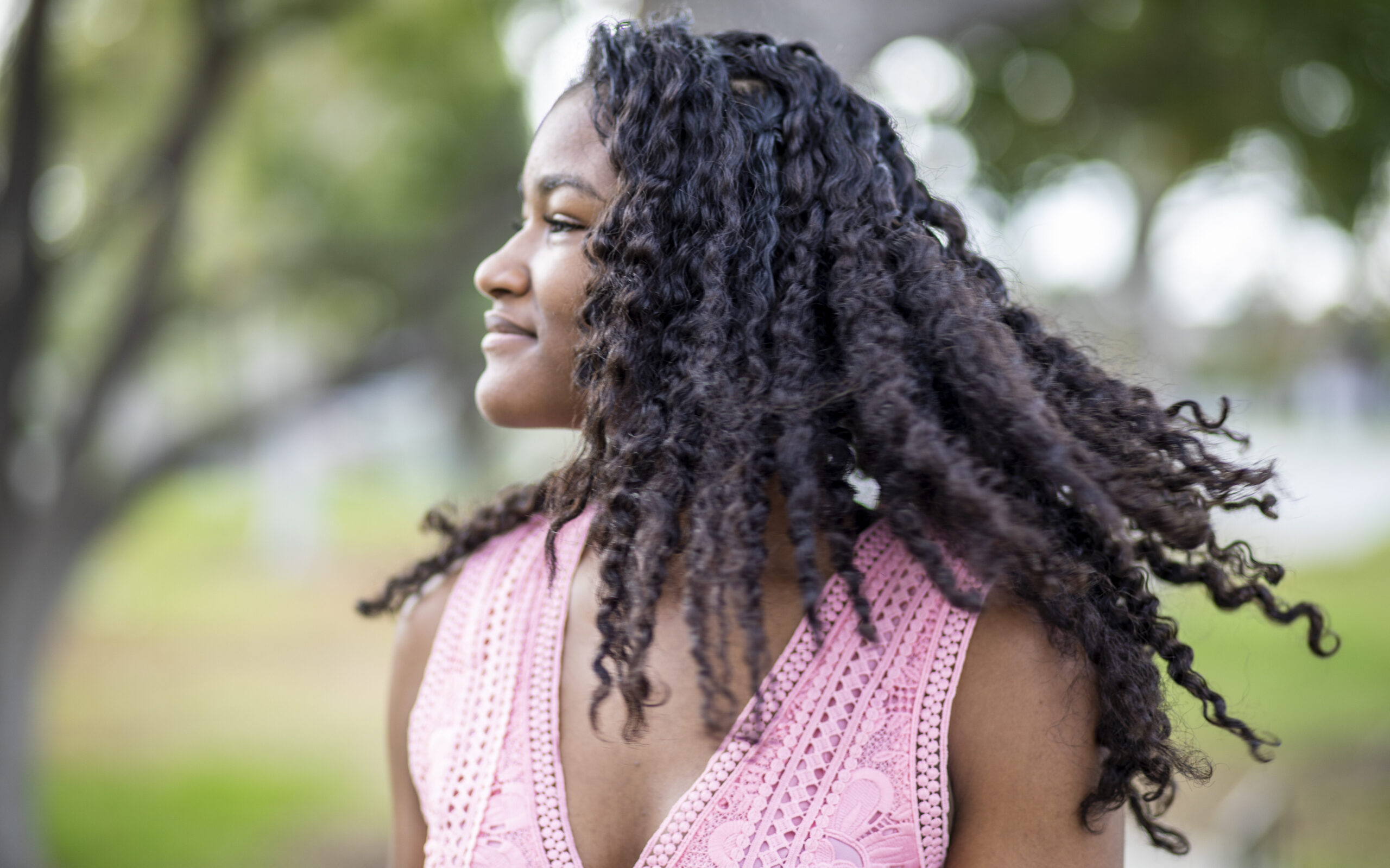 A young black girl smiling and laughing, living a carefree life