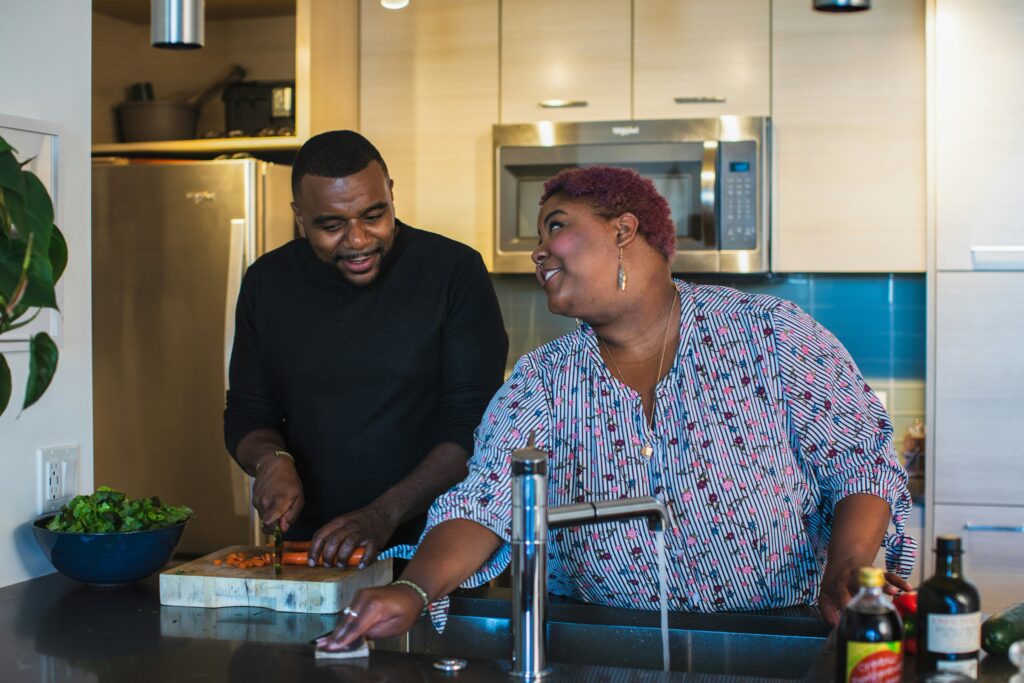 UTIs Refrigerator pictured: couple cooking in the kitchen