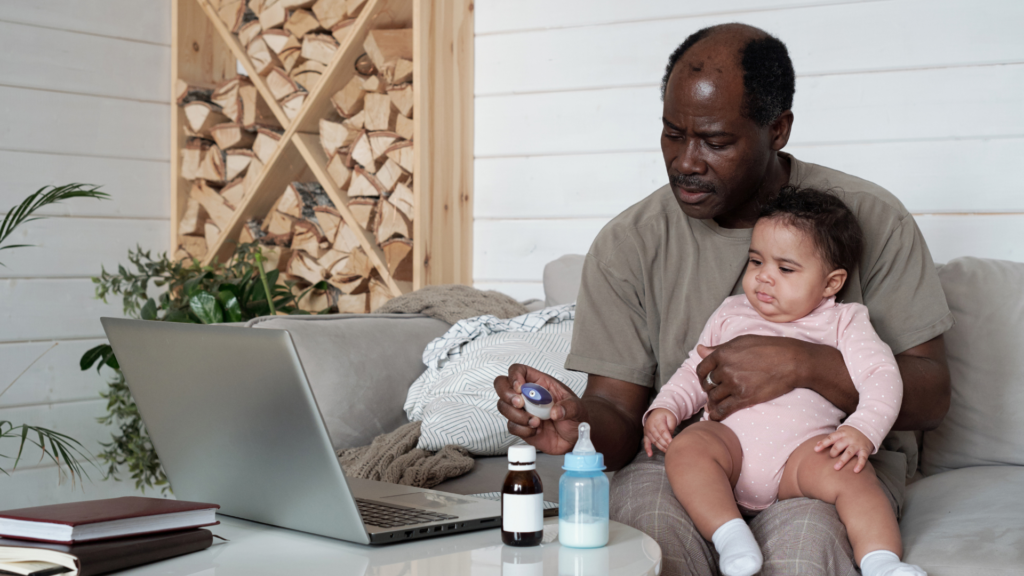 Caring Father And Baby With Common Cold