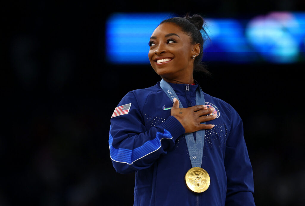 Paris 2024 Olympics - Artistic Gymnastics - Women's Vault Victory Ceremony - Bercy Arena, Paris, France - August 03, 2024. Gold medallist Simone Biles of United States celebrates on the podium