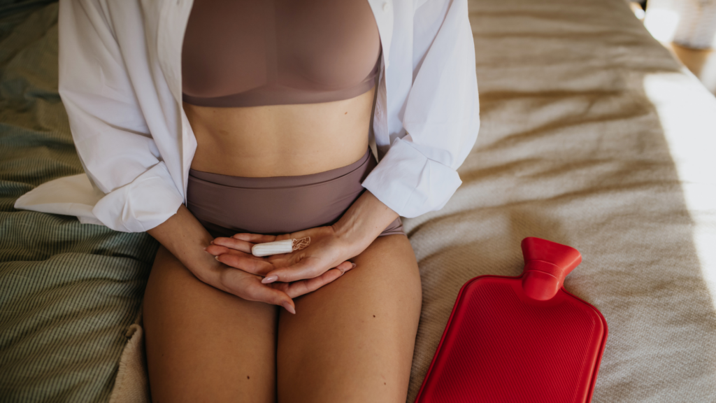 Woman Holding Menstrual Hygiene Products, Period Supplies Menstrual Cup and Tampon in Palms