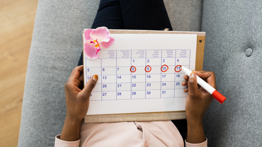 Woman Using Menstrual Cycle Calendar