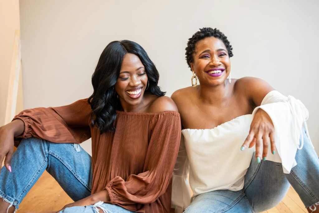 Full Moon in Aries pictured: friends laughing together