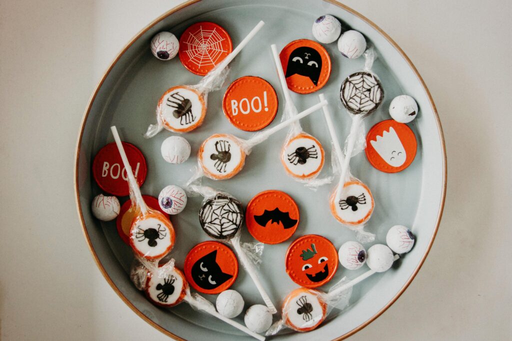 a bowl of Halloween candy with Halloween themed wrappers 