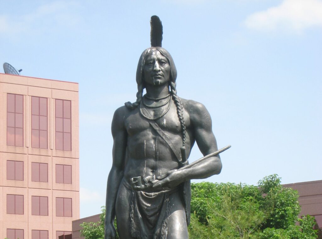 Sculpture entitled "Massasoit, Great Sachem of the Wampanoag, Friend and Protector of the Pilgrims, 1621" of Chief Massasoit bare-chested with a feather in his head