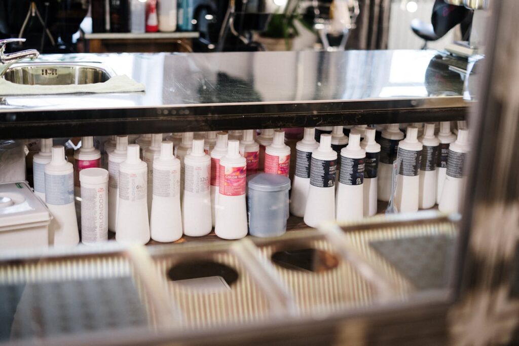 Cosmetic shampoo and conditioner bottles in a beauty salon